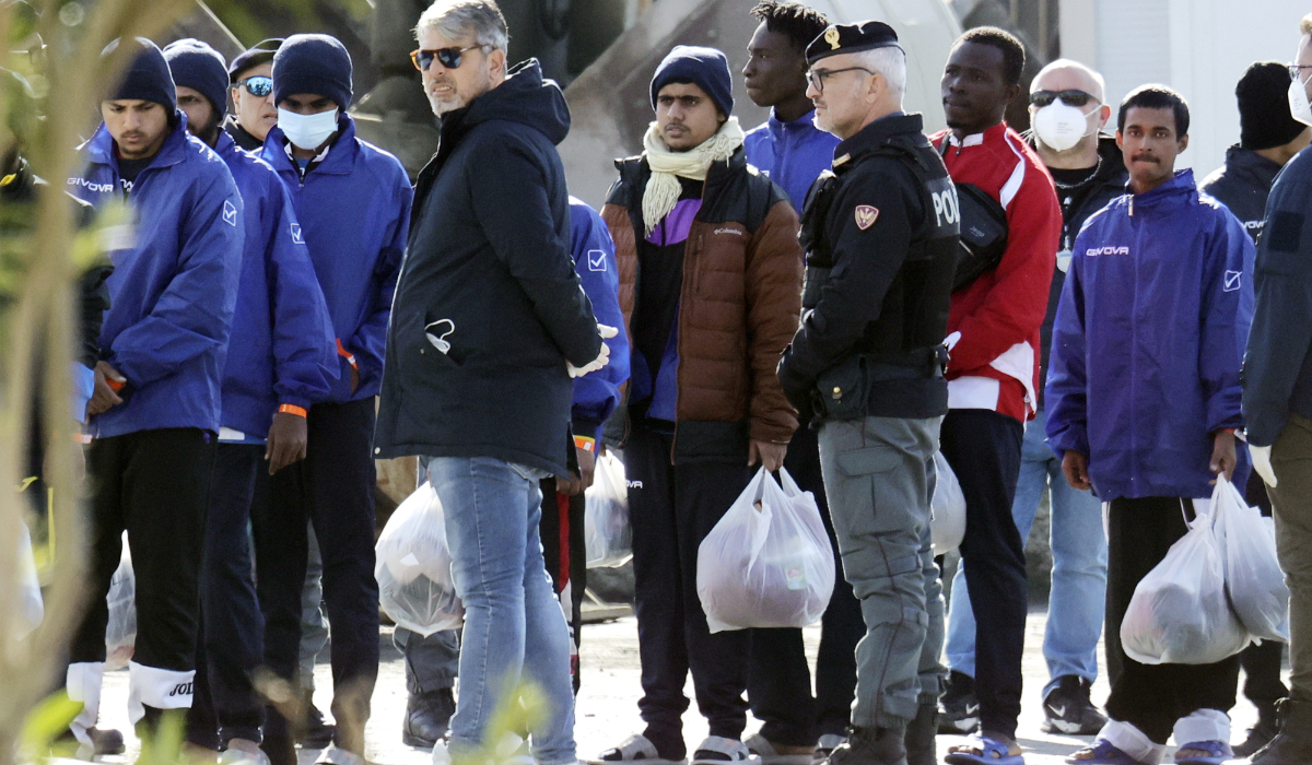 Migrants follow the authorities after their arrival in the port of Shengjin, northwestern Albania, Jan. 28, 2025. (AP)
