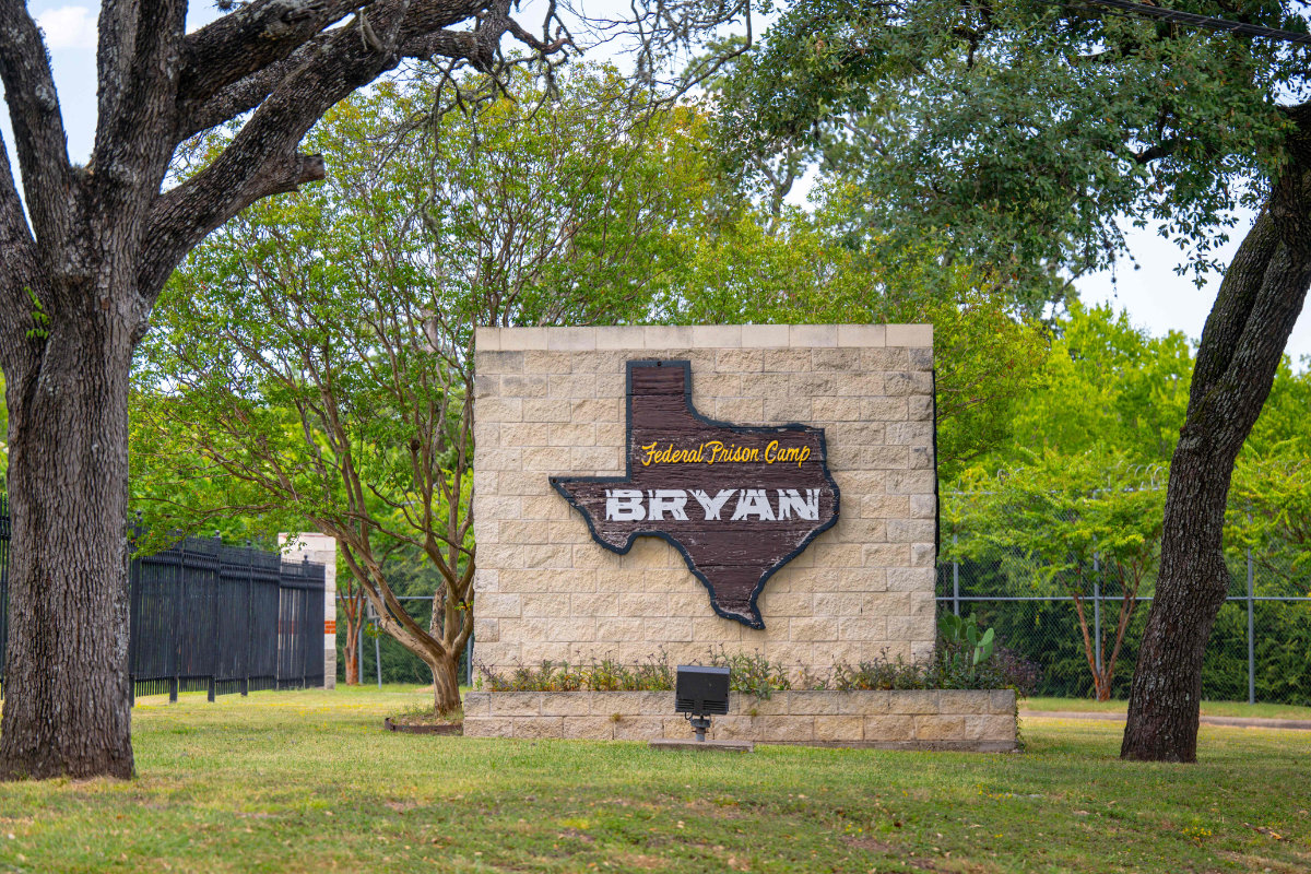 Signage is displayed near the entrance to Federal Prison Camp Bryan in Bryan, Texas, where Jeffrey Epstein's former girlfriend, Ghislaine Maxwell, has been transferred from a federal prison in Florida. (Getty Images via AFP)