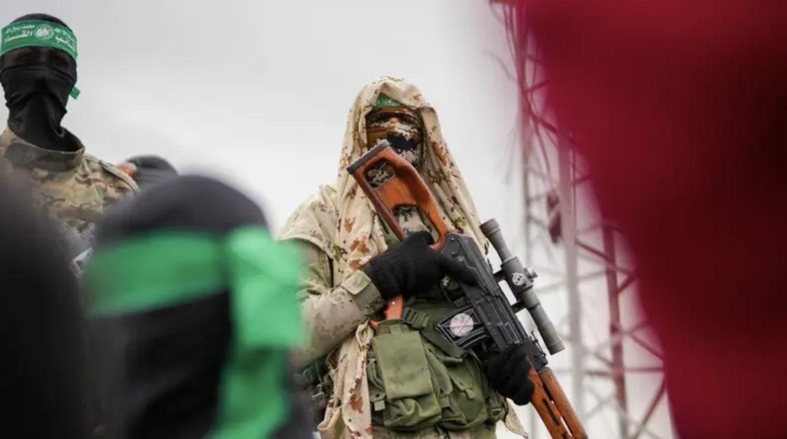 Hamas fighter in combat fatigues stands before the ceremony for the handover of Israeli hostages to the Red Cross in Nuseirat in February. (AP/File Photo)