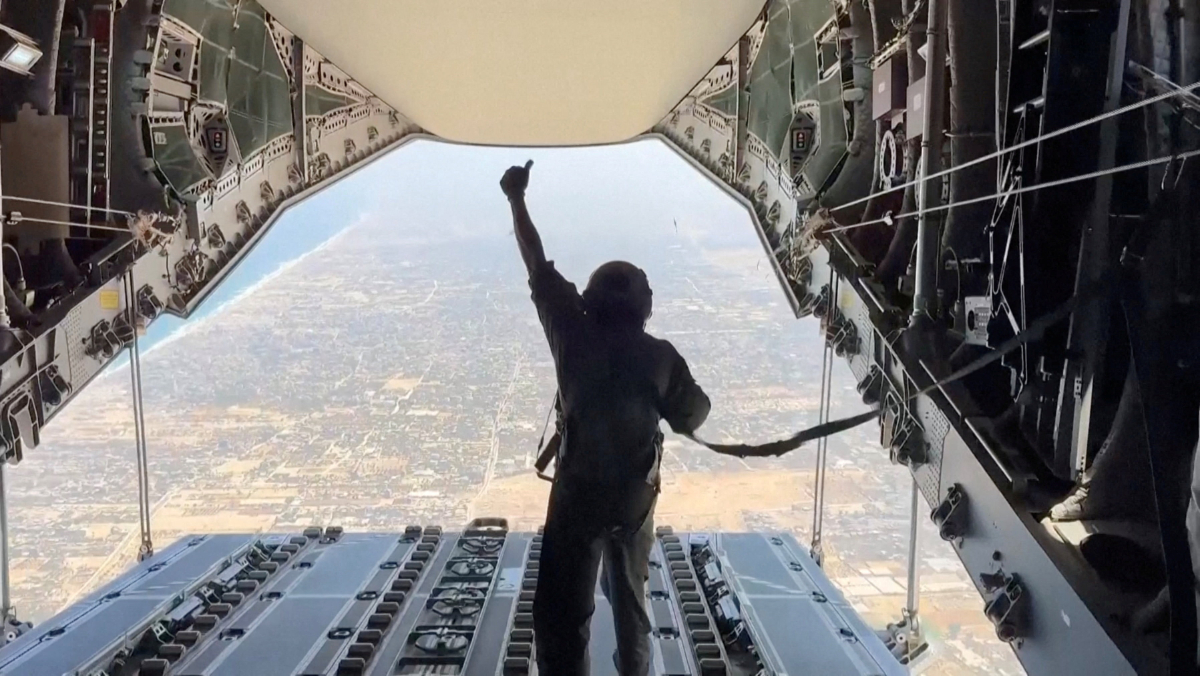 Spanish military personnel gives a thumbs up after humanitarian aid was dropped over the Gaza Strip from a Spanish aircraft, August 1, 2025, in this screengrab from video. (REUTERS)