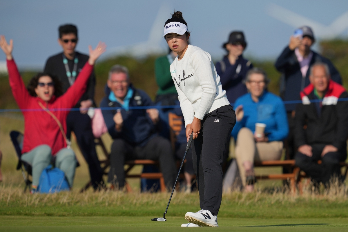 Miyu Yamashita of Japan reacts as she holes a par putt on the 17th green during the third round of the Women’s British Open golf championship, at Royal Porthcawl Golf Club in Porthcawl, Wales, Saturday. (AP)