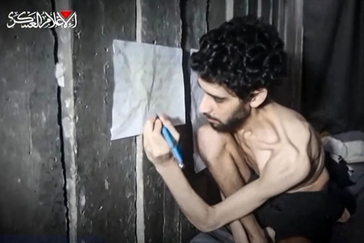 This screengrab from a video released by the armed wing of Palestinian militant group Hamas shows Israeli hostage Evyatar David looking weak and malnourished, August 1, 2025. (AFP)