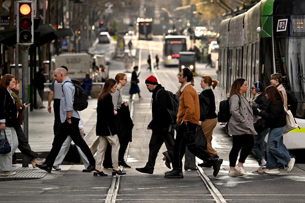 Australia’s largest cohorts of students come from China and India. Above, people cross a street in Melbourne’s central business district on Aug. 14, 2024. (AFP)