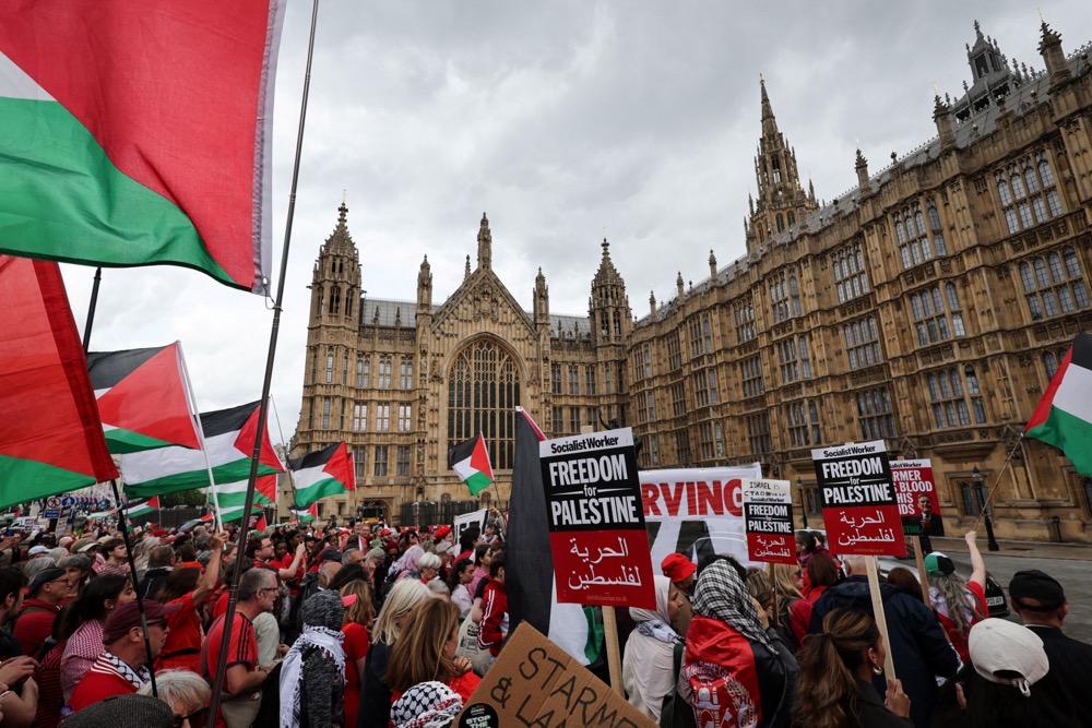 Protesters wave Palestinian flags and hold placards outside the Palace of Westminster in central London, on June 4, 2025. (AFP)