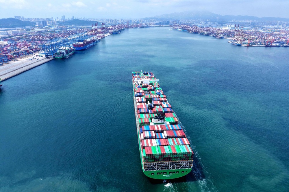 A container ship waits to berth at the port in Qingdao, in Chinaís eastern Shandong province. (AFP)