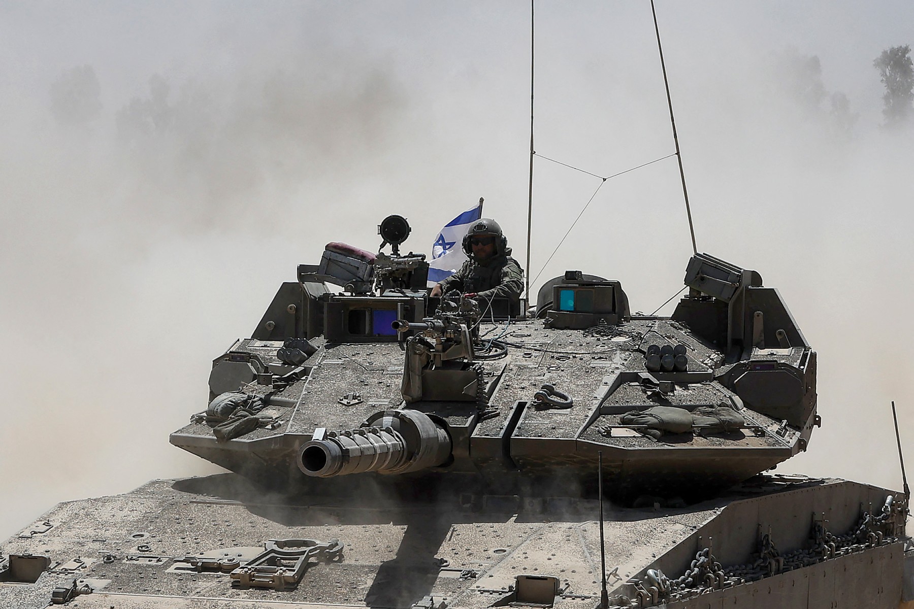 An Israeli soldier rides in a military vehicle at Israel's southern border with the Gaza Strip on May 20, 2025. (File/AFP)