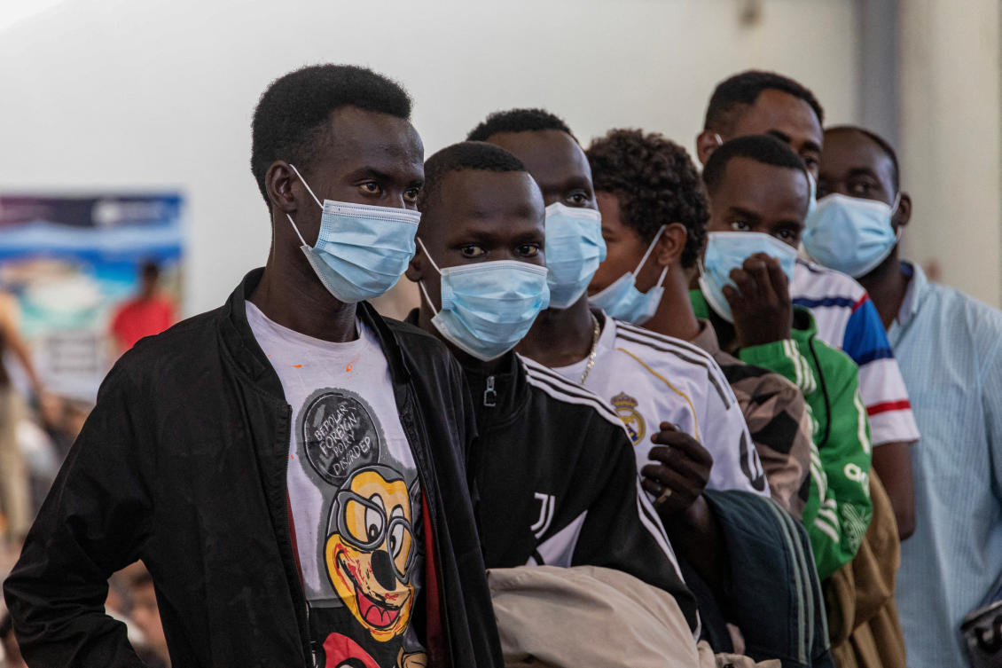 Newly-arrived migrants line up inside a municipal hall in the town of Agyia, on the island of Crete, Greece, July 13, 2025. (Reuters/File)