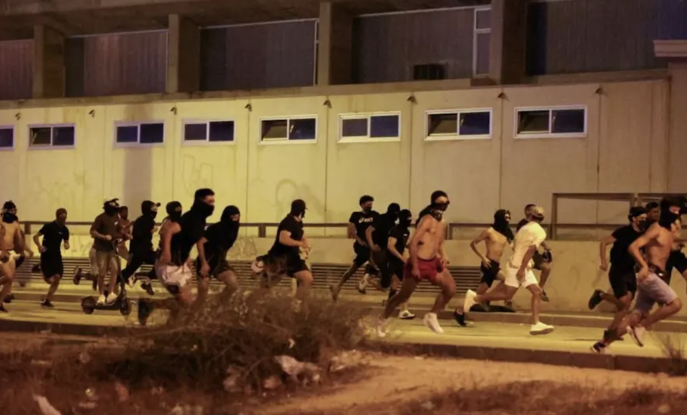 The ban was passed by the conservative People’s Party, and backed by the far-right Vox party, weeks after the nearby town of Torre Pacheco saw anti-migrant unrest, above. (Reuters/File Photo)
