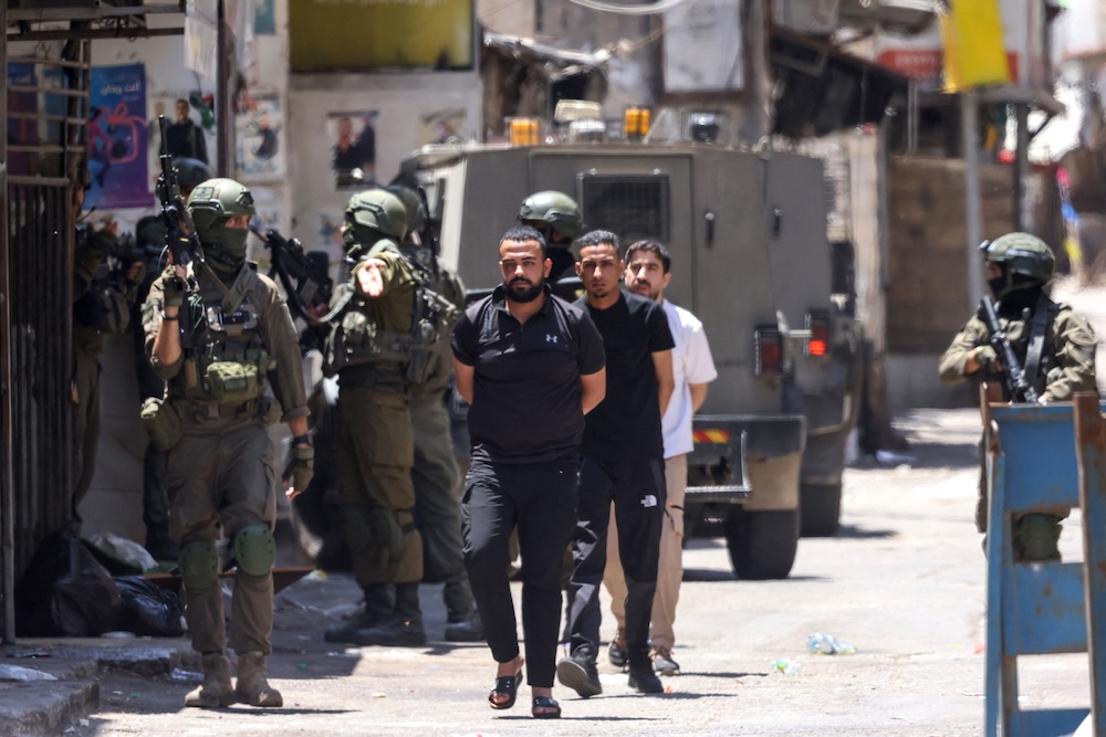 There are mounting concerns that Israeli staffers working at Microsoft’s facility in the country may have hidden key details about their relationship with Unit 8200 to execute mass surveillance and targeting of Palestinians. (AFP)