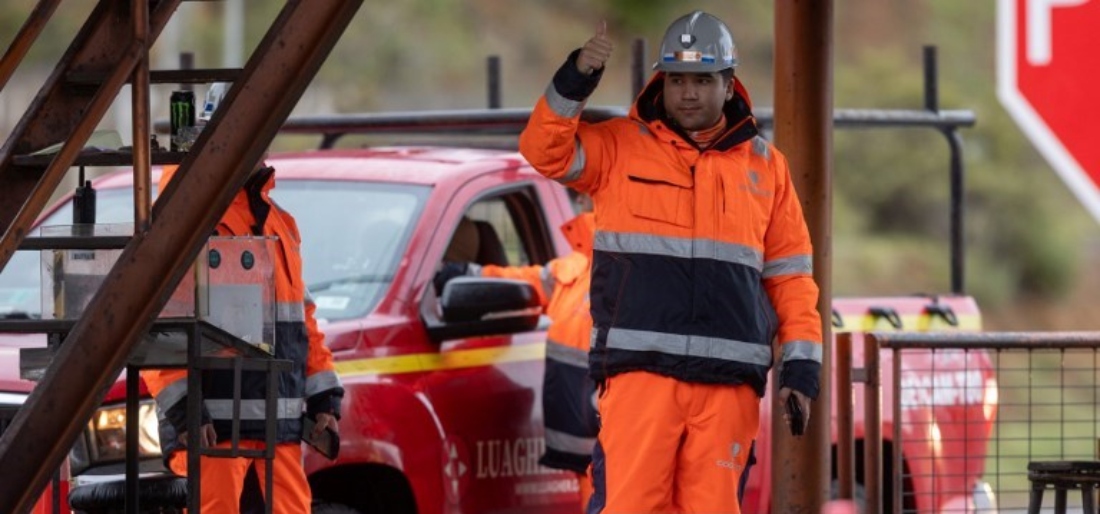 A worker gestures at the entrance to the El Teniente mine in O'Higgins Region, Chile. (AFP)