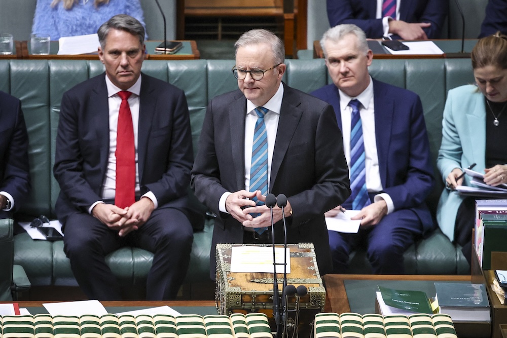 Australia’s Prime Minister Anthony Albanese, center, speaks during question time in the House of Representatives at Parliament House in Canberra on June 27, 2024. (AFP)
