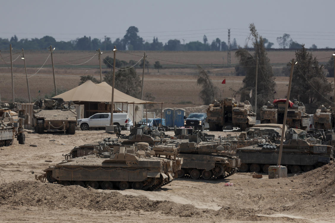 Israeli military vehicles stand near the border between Israel and Gaza, as seen from Israel, August 10, 2025. (Reuters)