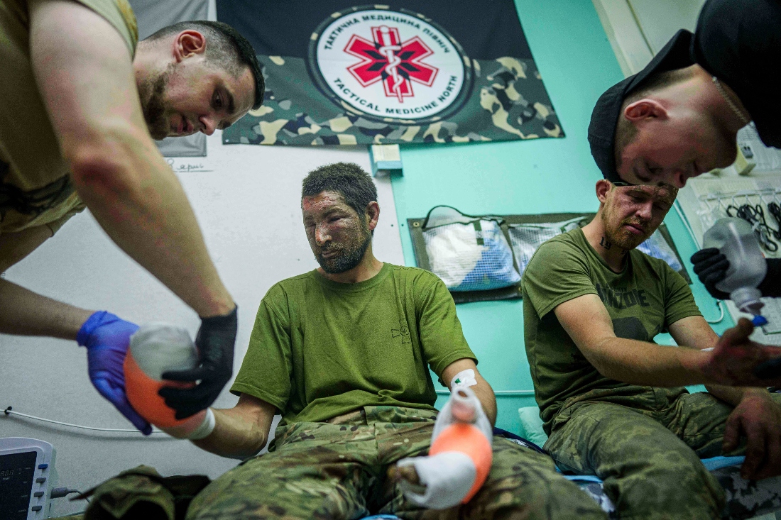 Ukrainian medics of Da Vinci Wolves Battalion treat their injured comrades at a stabilisation point on Pokrovsk direction, Ukraine. (AP)