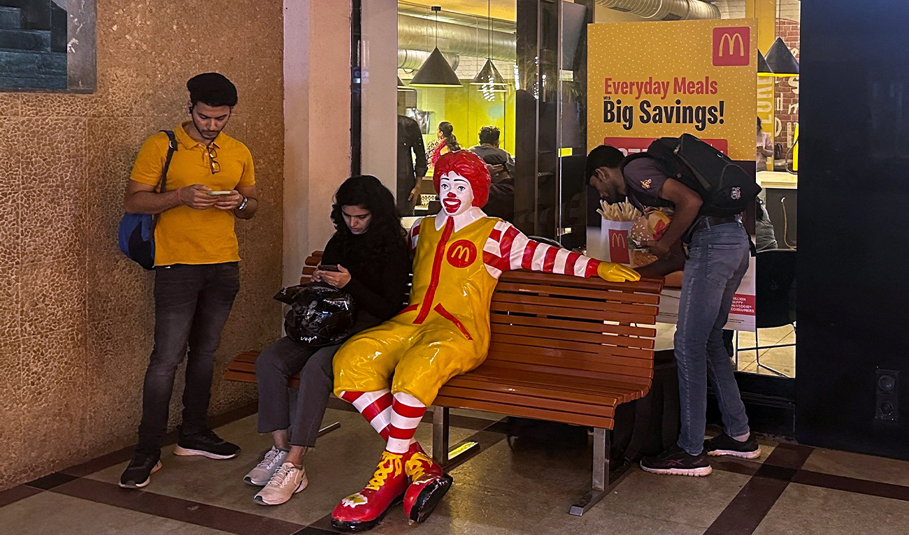 A person sits outside a McDonald’s restaurant in Mumbai, India, on February 26, 2024. (REUTERS/File)