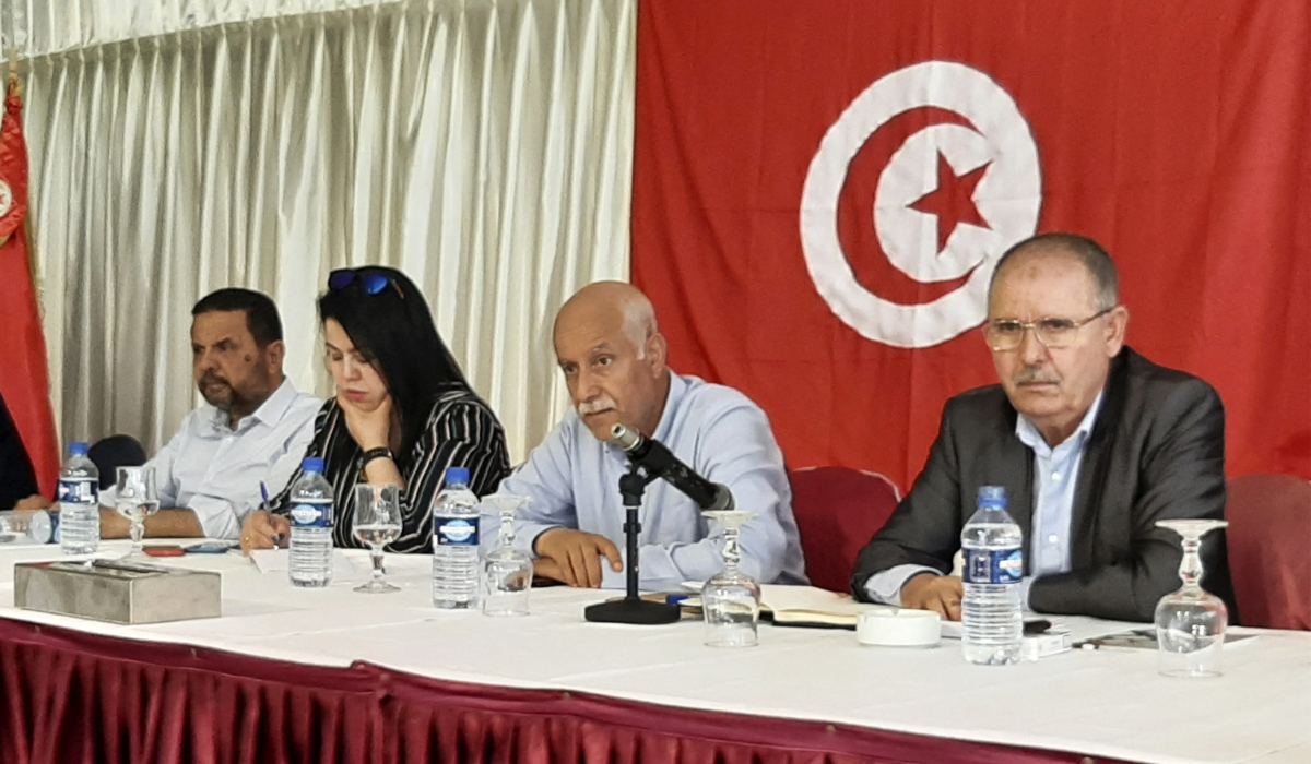 Noureddine Taboubi (R), Secretary-General of the Tunisian General Labour Union (UGTT), chairs the meeting of the body's national administrative commission in Hammamet on May 23, 2022. (AFP)