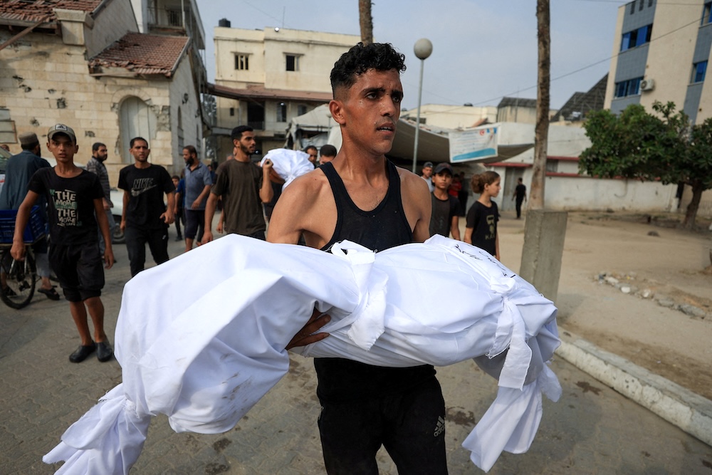 Israel bombards Gaza City overnight; Hamas leader due in Cairo in bid to salvage ceasefire