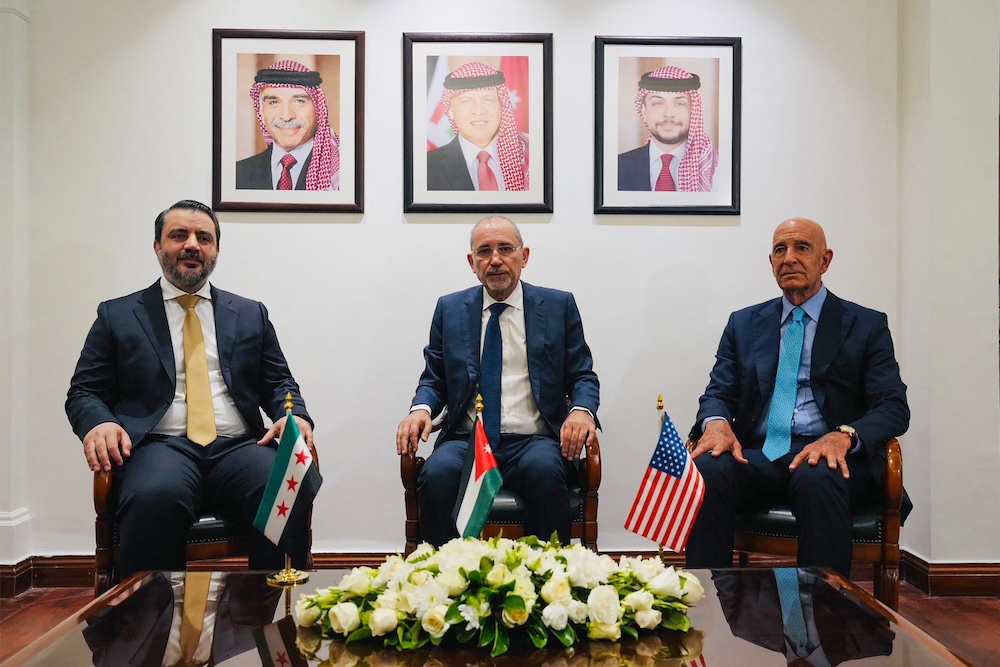 From left: Syria’s interim foreign minister Asaad Al-Shaibani, Jordan’s Foreign Minister Ayman Safadi, and US special envoy for Syria Tom Barrack during their meeting in Amman on Aug. 12, 2025. (Jordanian Foreign Ministry/AFP)