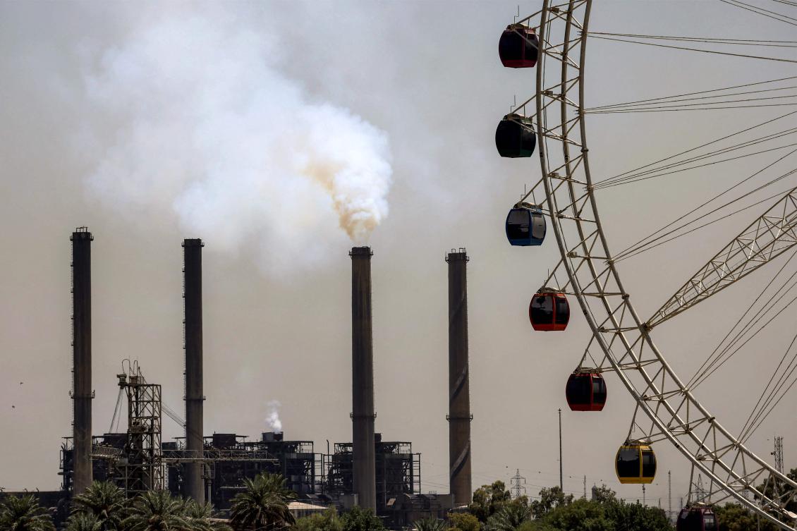 A large Ferris wheel is pictured near the Dora (Daura) Thermal Power Station in the Dora district of southern Baghdad on August 12, 2025. (AFP)