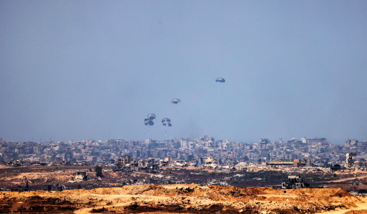 Humanitarian aid packages are airdropped over the Gaza Strip on Saturday. (Reuters)