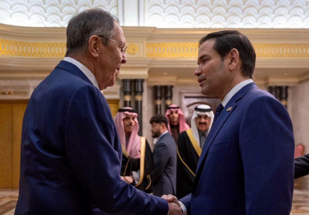 US Secretary of State Marco Rubio shakes hands with Russian FM Sergei Lavrov during their meeting in Diriyah Palace, Riyadh, Saudi Arabia, Feb. 18, 2025. (AFP)