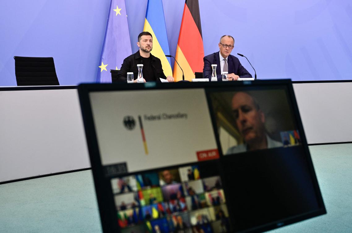 Ukrainian President Volodymyr Zelensky and German Chancellor Friedrich Merz attend a video conference of European leaders with the US President on Wednesday on the Ukraine war ahead of the summit between the US and Russian leaders. (AFP)