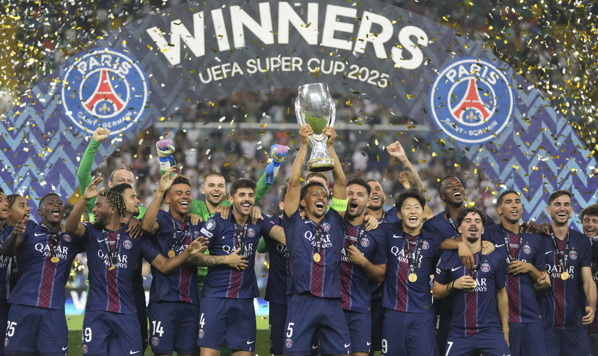 PSG’s captain Marquinhos lifts the trophy with teammates after the UEFA Super Cup match between Paris Saint-Germain and Tottenham Hotspur in Udine, Italy, Wednesday. (AP)