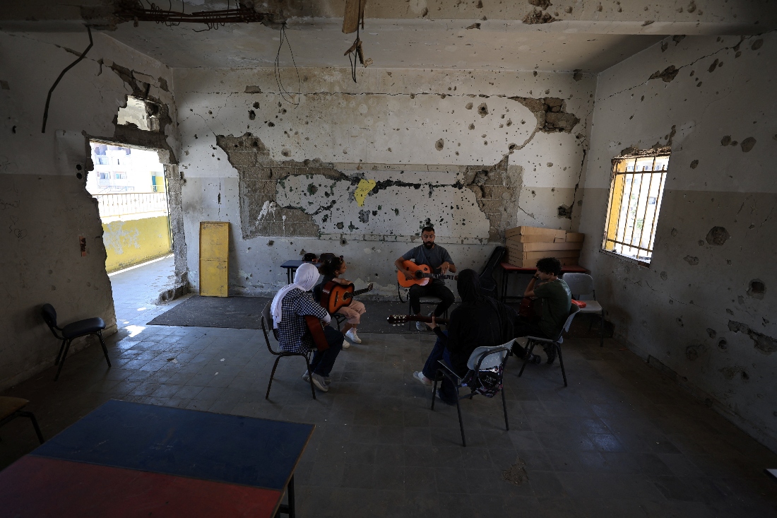 Music instructor Mohammed Abu Mahadi of the Edward Said National Conservatory of Music conducts a lesson at Gaza College in Gaza City. (Reuters)