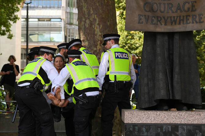 Police officers detain a protester during a rally organised by Defend Our Juries, challenging the British government's proscription of "Palestine Action" under anti-terrorism laws, in London on August 9, 2025. (Reuters)