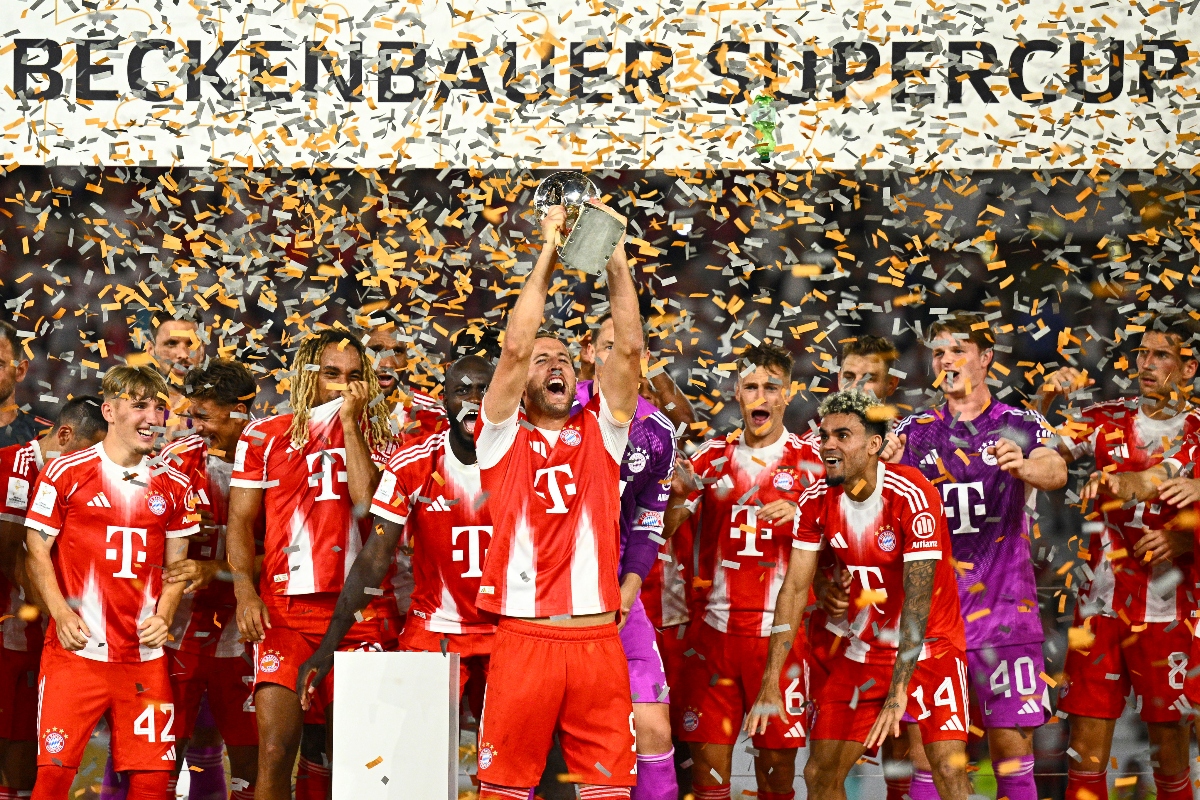 Bayern’s Harry Kane celebrates with teammates after winning the German Supercup final between VfB Stuttgart and Bayern Munich in Stuttgart Saturday. (Tom Weller/dpa via AP)