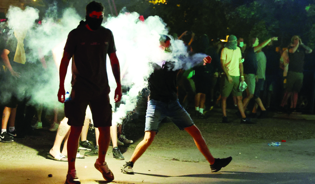 Anti-government demonstrators protest outside the offices of the ruling Serbian Progressive Party (SNS), in Valjevo, Serbia, August 16, 2025. (REUTERS)