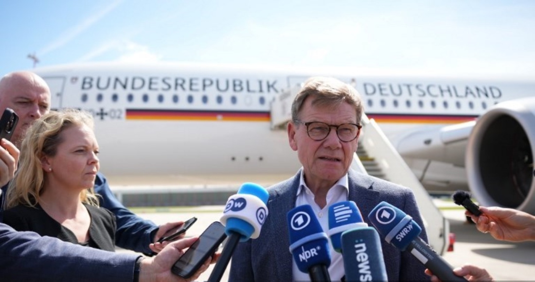 German Foreign Minister Johann Wadephul makes a statement at Hamburg Airport in Germany before his departure for Tokyo. (AFP)