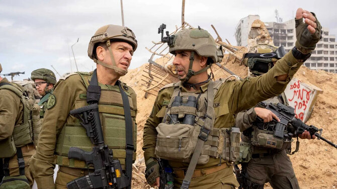 Aharon Haliva, left, in Gaza in December 2023, before his resignation over intelligence failings ahead of the October 7 attack. (Israel Defense Forces)