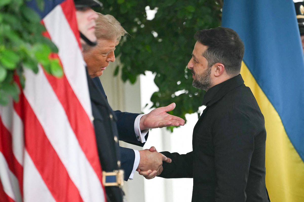 Ukrainian President Volodymyr Zelensky is greeted by US President Donald Trump upon arrival at the White House. (AFP)