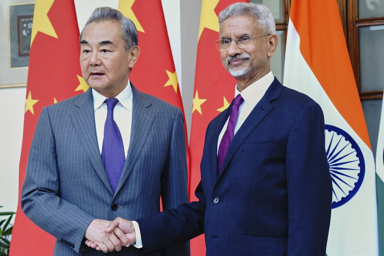 Indian Foreign Minister S. Jaishankar shakes hand with his Chinese counterpart Wang Yi, left, in New Delhi, India, Monday, Aug. 18, 2025. (AP)