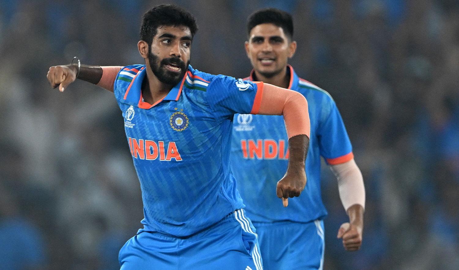 ndia's Jasprit Bumrah (L) celebrates with teammate Shubman Gill after taking the wicket of Australia's Mitchell Marsh during the 2023 ICC Men's Cricket World Cup one-day international (ODI) final match between India and Australia at the Narendra Modi Stadium in Ahmedabad on November 19, 2023. (AFP/File)