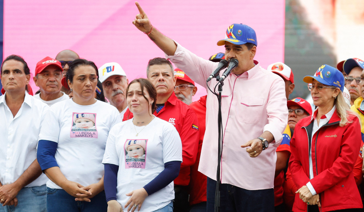 Venezuela's President Nicolas Maduro gestures as he speaks next to his wife Cilia Flores (R) and Yorely Bernal (3rd-L), mother of the Venezuelan child Maikelys Espinoza, 2 years old, held in the US, during a march to commemorate May Day (Labour Day), marking International Workers' Day in Caracas on May 1, 2025. (AFP)