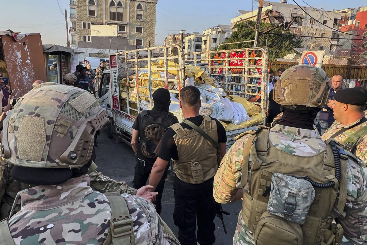 Lebanese Army soldiers stand next to a truck carrying weapons handed over by Palestinian factions at the Burj al-Barajneh Palestinian refugee camp in Beirut, Lebanon, on Aug. 21, 2025. (AP Photo)