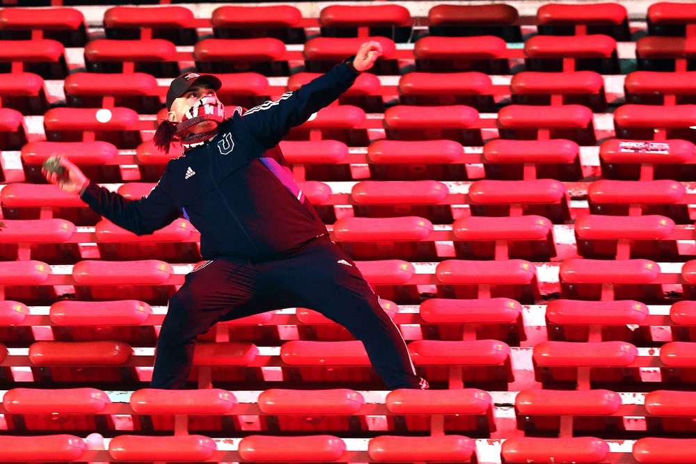 A fan of Universidad de Chile prepares to throw a stone during the interruption of the Copa Sudamericana round of 16 second leg football match between Argentina's Independiente and Chile's Universidad de Chile at the Libertadores de America stadium in Avellaneda, Buenos Aires province, Argentina. (AFP)
