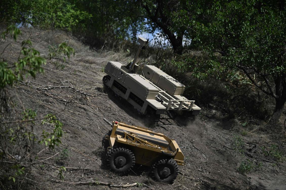 Above, unmanned ground vehicles roll on a training ground at an undisclosed location in eastern Ukraine on Aug. 13, 2025. (AFP)