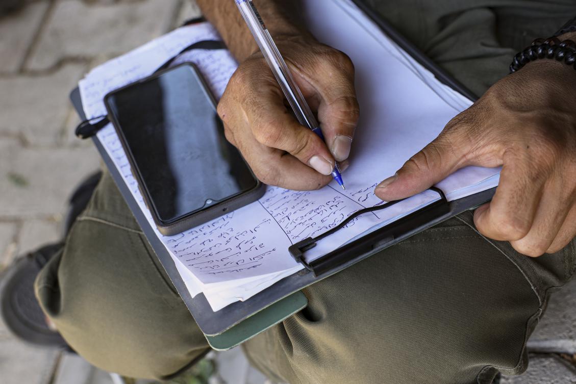 A Kurdish man signs up to join the Syrian government’s General Security forces at a police station in Afrin, Syria on Aug. 21, 2025. (AP)