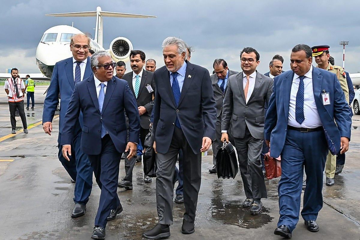 This handout photograph taken and released by Bangladesh's Ministry of Foreign Affairs on Aug. 23, 2025 shows Bangladesh's Foreign Secretary Asad Alam Siam receiving Ishaq Dar, Pakistan's Deputy PM and Foreign Minister, at the Hazrat Shahjalal International Airport in Dhaka. (AFP)