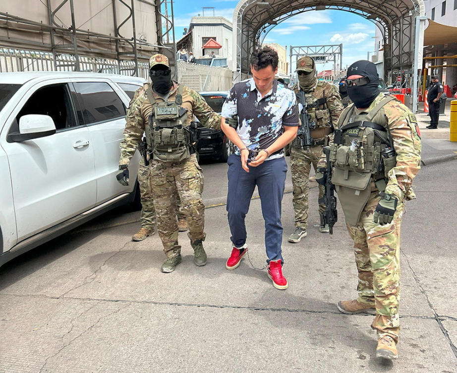 US Immigration and Customs Enforcement (ICE) officers escort Mexican boxer Julio Cesar Chavez Jr., center, in this picture released Aug. 21, 2025. (ICE via Reuters)
