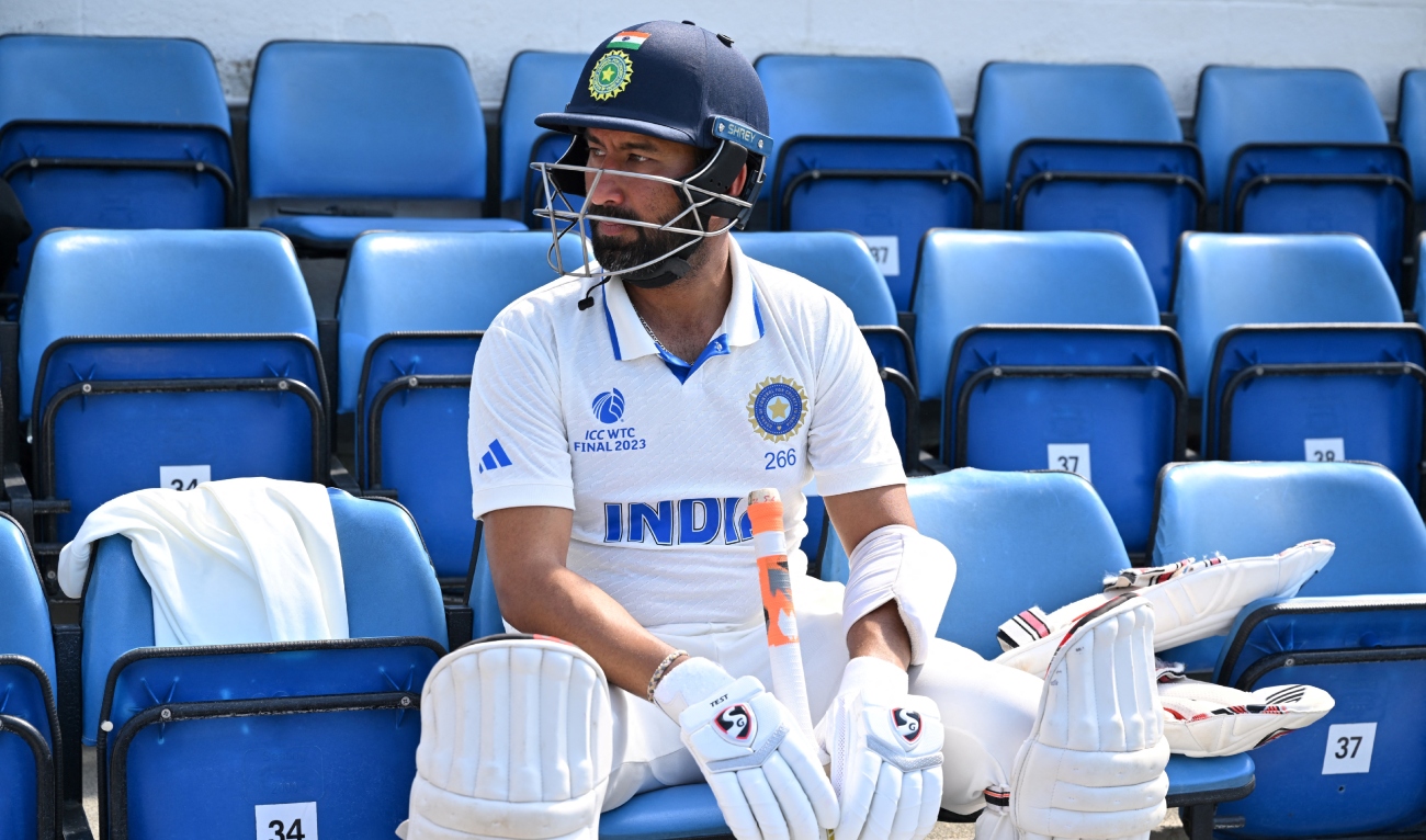 India's Cheteshwar Pujara prepares to enter the field during play on day 4 of the ICC World Test Championship cricket final match between Australia and India at The Oval, in London, on June 10, 2023. (AFP/File)