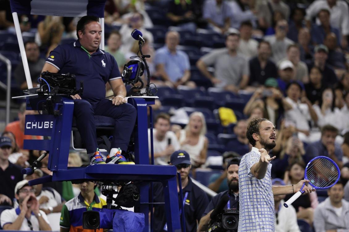 Daniil Medvedev, bottom right, reacts next to chair umpire, Greg Allensworth, left, after a photographer ran onto the court during a match against Benjamin Bonzi in the first-round of the US Open tennis championships on Aug. 24, 2025. (AP)