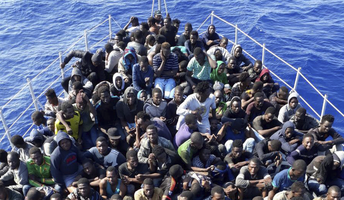 In this June 24, 2018 file photo, released by the Libyan coast guard, African migrants who were on boats in distress in the Mediterranean on their way to Europe, and rescued by the Libyan coast guard arrive to shore, east of the capital, Tripoli, Libya. (AP)