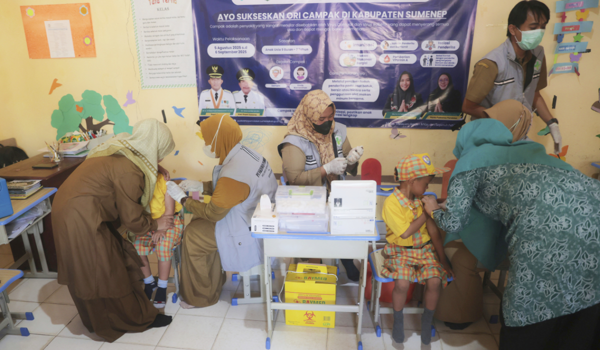 Health workers give measles vaccine to children during a measles vaccination campaign following an outbreak, in Sumenep, East Java, Indonesia, Monday, Aug. 25, 2025. (AP)