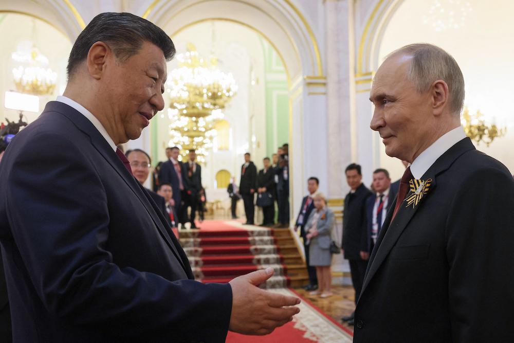 Russia’s President Vladimir Putin and Chinese President Xi Jinping attend a reception for celebrations of the Victory Day at the Kremlin in Moscow on May 9, 2025. (AFP file photo)