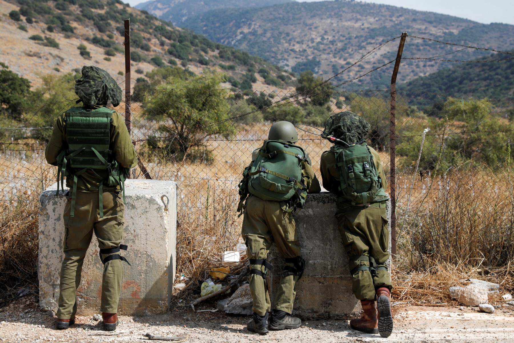 Israeli soldiers take positions near the Israeli military base of Har Dov on Mount Hermon, a strategic and fortified outpost at the crossroads between Israel, Lebanon, and Syria, on October 10, 2023. (AFP)