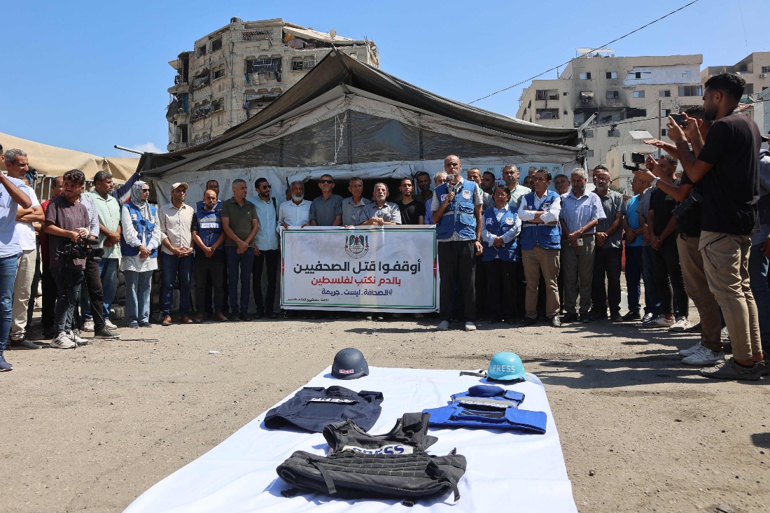 Demonstrators gather in solidarity with journalists killed by Israeli strikes in the Gaza Strip, during a protest organised by the Gaza Journalists Syndicate, in Gaza City. (AFP)