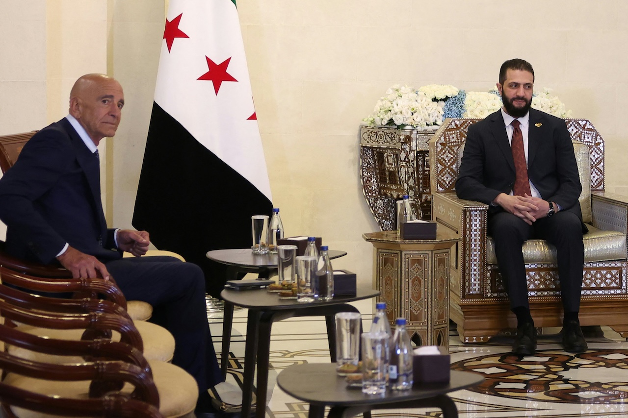 Syria's interim President Ahmad al-Sharaa (R) receives US Special Envoy to Syria Thomas Barrack, at the presidential palace in Damascus on July 9, 2025. (File/AFP)